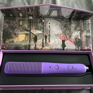 Never used Curling iron,flat iron, hairbrush, all in one.